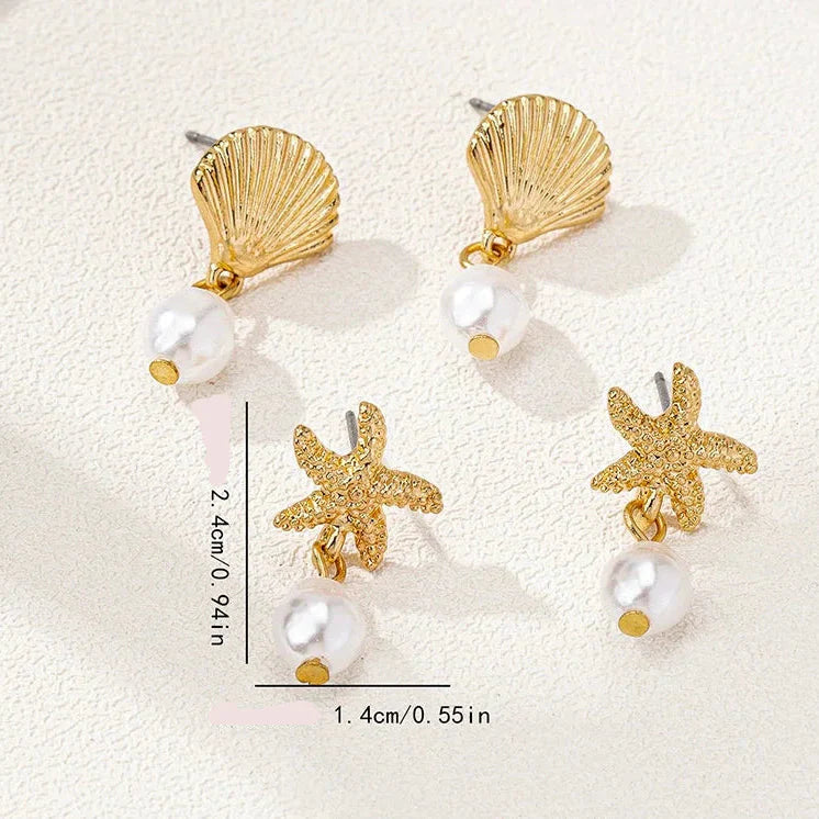 Boucles d'oreilles dorées coquillage et perle