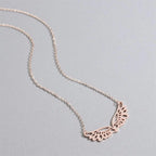 Collier avec large pendentif ailes d'ange or rose