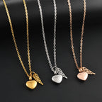 Collier d'urne avec pendentif ailes d'ange et coeur or