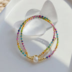 Collier ras de cou avec pendentif arc-en-ciel et perles